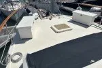 Slide: The Image of 1978 Hatteras 43 Double Cabin yacht deck with storage boxes and railing. - 6