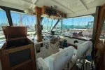 Slide: The Image of Interior view of 1978 Hatteras 43 Double Cabin yacht cockpit with steering wheel and controls. - 27