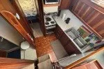 Slide: The Image of 1978 Hatteras 43 Double Cabin interior with kitchen and bathroom view. - 15