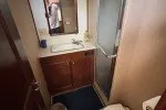 Slide: The Image of 1978 Hatteras 43 Double Cabin bathroom with sink, mirror, and shower. - 14