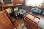 Slide: The Image of 1978 Hatteras 43 Double Cabin yacht kitchen with wood cabinetry and modern appliances. - 23