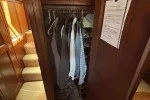 Slide: The Image of Closet interior on 1978 Hatteras 43 Double Cabin yacht with hanging clothes. - 19