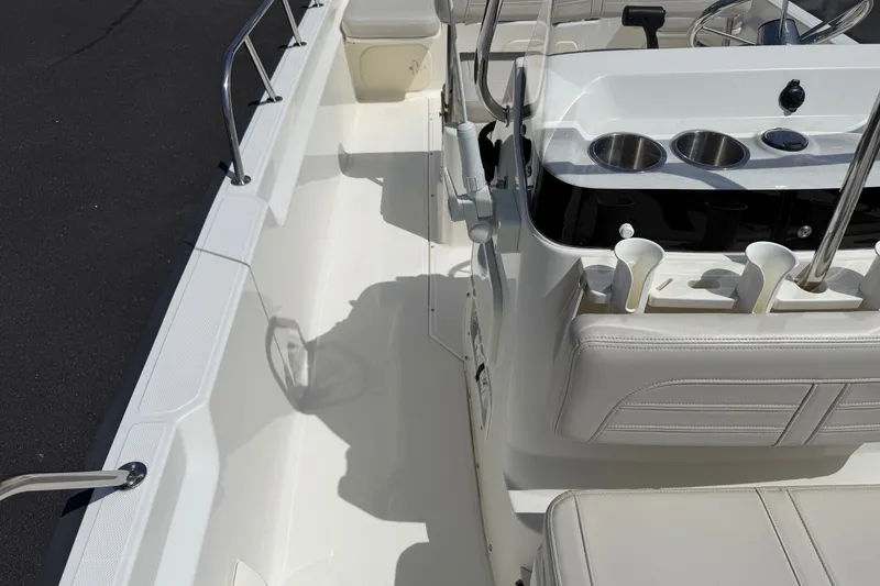 Slide: The Image of 2022 Boston Whaler 170 Montauk boat interior with seating and console details. - 7