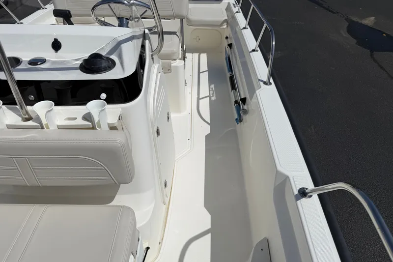 Slide: The Image of 2022 Boston Whaler 170 Montauk interior with steering console and seating. - 8