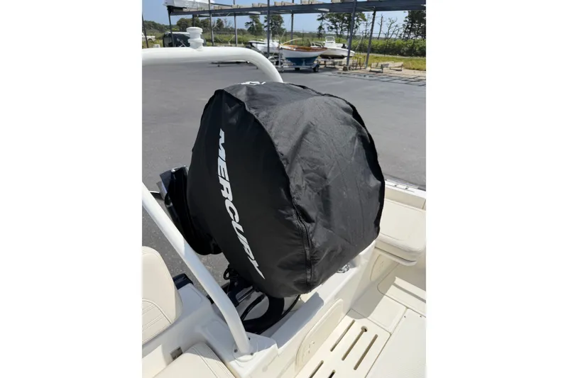 Slide: The Image of 2022 Boston Whaler 170 Montauk with covered Mercury outboard motor. - 17