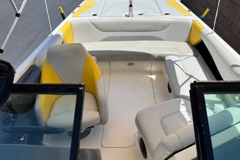 Slide: The Image of 2003 Centurion Cyclone C4 boat interior with yellow and white seating. - 15