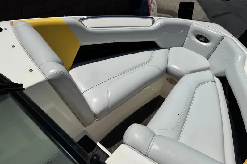 Slide: The Image of 2003 Centurion Cyclone C4 boat interior with white and yellow seating. - 12