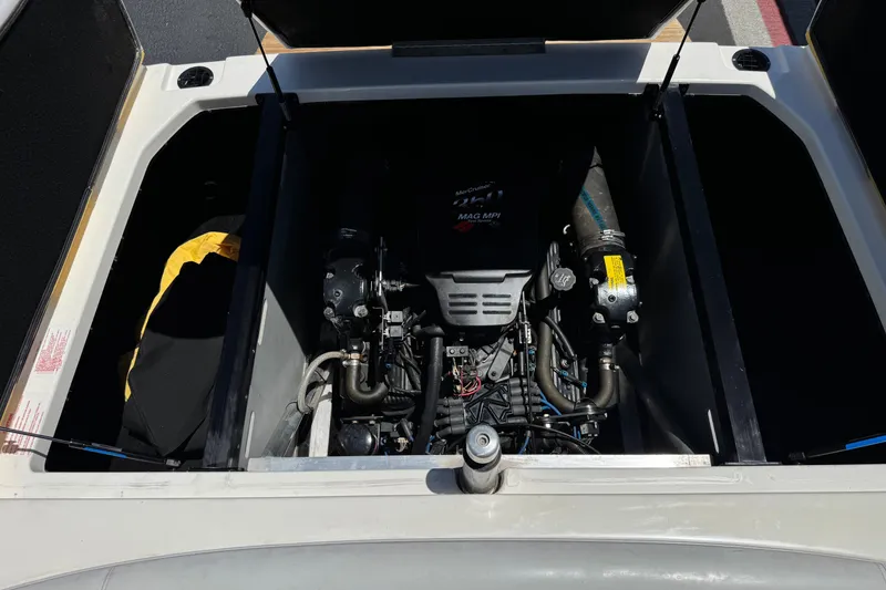 Slide: The Image of Engine compartment of a 2003 Centurion Cyclone C4 boat, featuring a MerCruiser MAG MPI engine. - 21