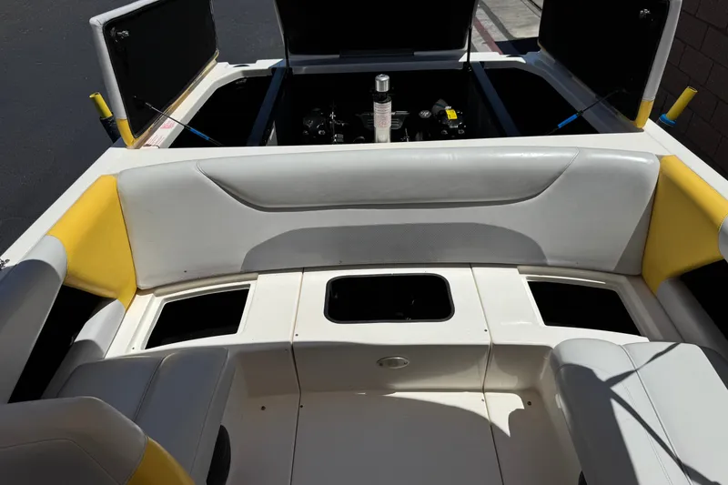 Slide: The Image of 2003 Centurion Cyclone C4 boat interior with open engine compartment and seating. - 20