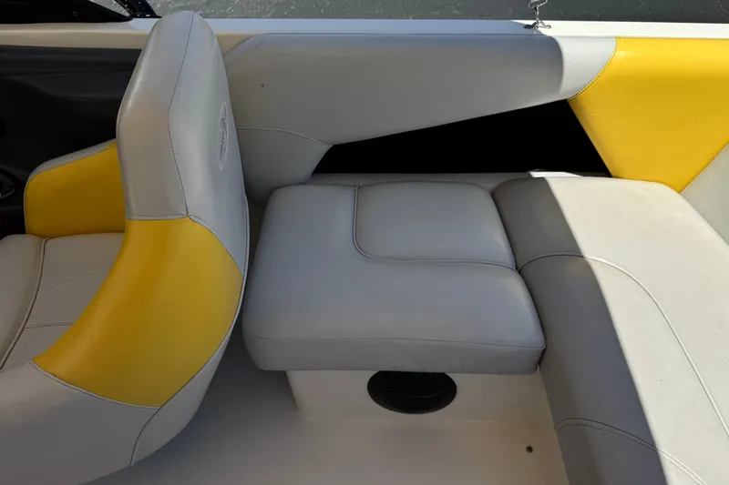 Slide: The Image of 2003 Centurion Cyclone C4 boat interior with yellow and gray seating. - 23