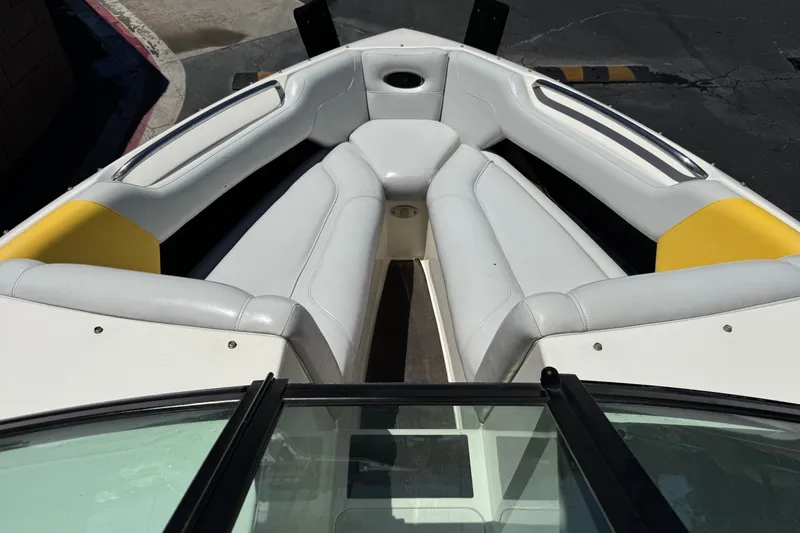 Slide: The Image of 2003 Centurion Cyclone C4 boat interior with white and yellow seating. - 11