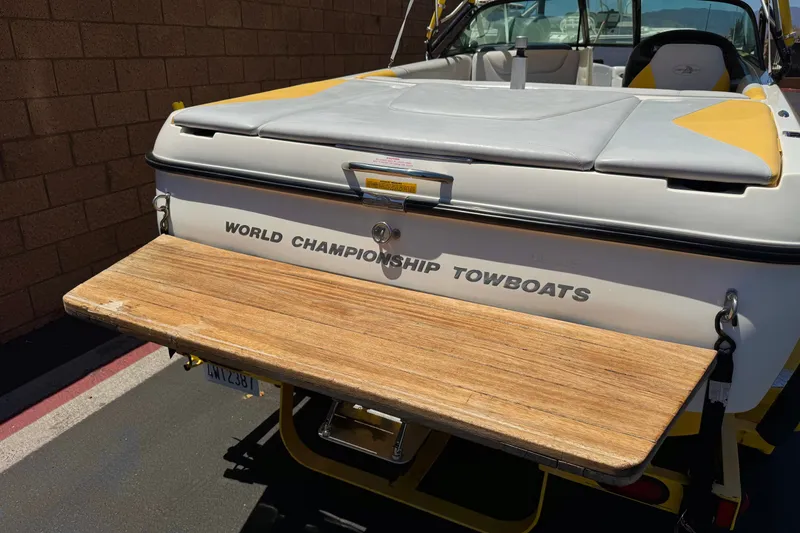 Slide: The Image of 2003 Centurion Cyclone C4 boat with "World Championship Towboats" branding, wooden swim platform. - 6