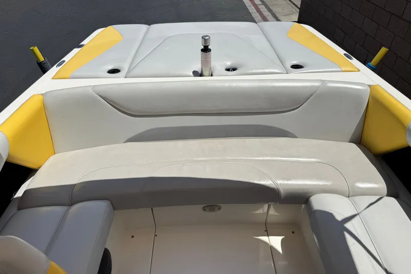 Slide: The Image of 2003 Centurion Cyclone C4 boat interior with yellow and white seating. - 19