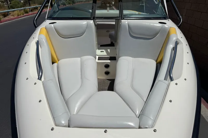 Slide: The Image of 2003 Centurion Cyclone C4 boat interior with white and yellow seating. - 10