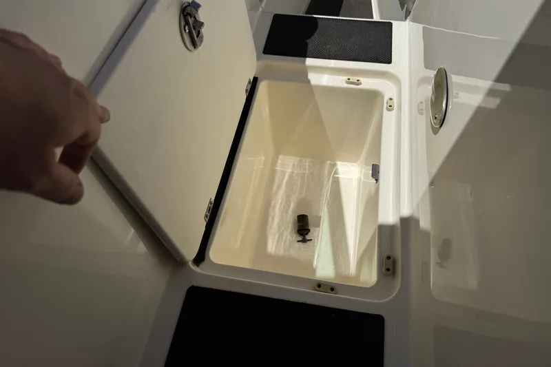 Slide: The Image of Open storage compartment on a 2003 Centurion Cyclone C4 boat. - 14