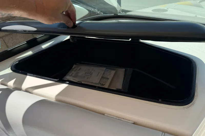 Slide: The Image of Open storage compartment in a 2003 Centurion Cyclone C4 boat. - 26