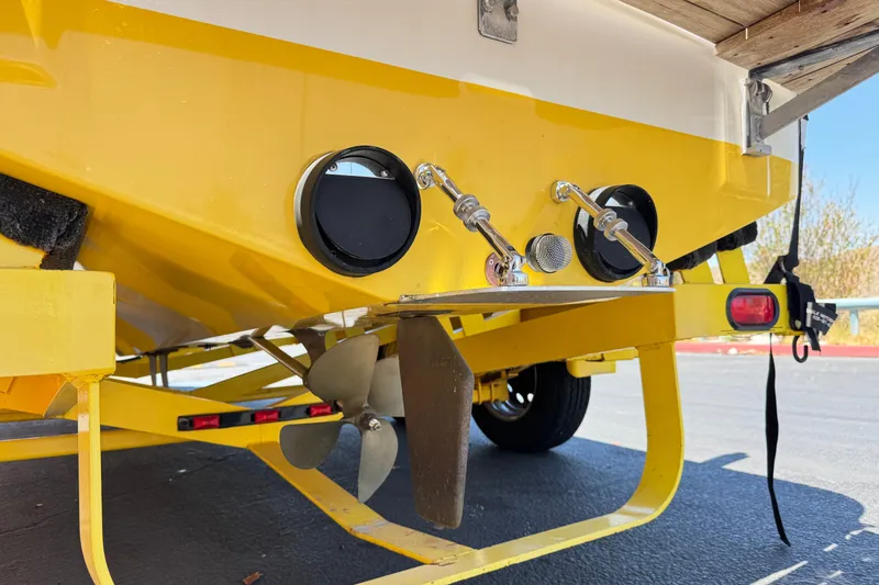 Slide: The Image of Yellow 2003 Centurion Cyclone C4 boat stern with propeller and exhaust details. - 7