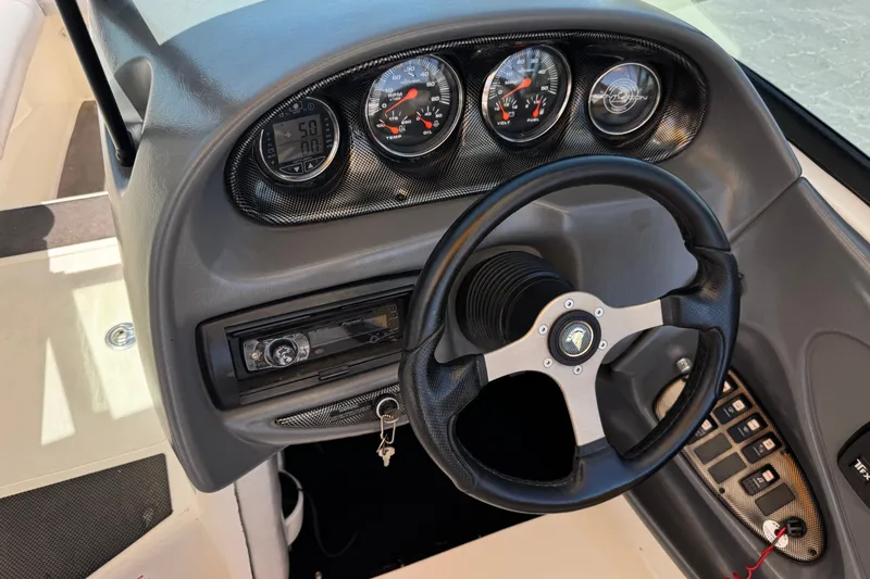 Slide: The Image of 2003 Centurion Cyclone C4 dashboard with steering wheel and gauges. - 29