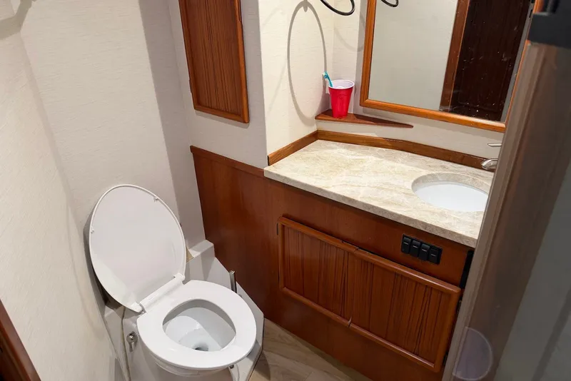 Slide: The Image of Bathroom interior of a 1996 Post 50 Convertible yacht with wooden cabinetry. - 30