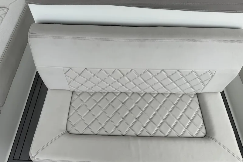 Slide: The Image of Luxurious white leather seating with diamond stitching in a 1996 Post 50 Convertible. - 14