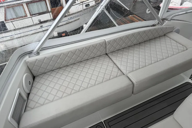 Slide: The Image of Luxurious seating on a 1996 Post 50 Convertible yacht, featuring diamond-stitched upholstery. - 15