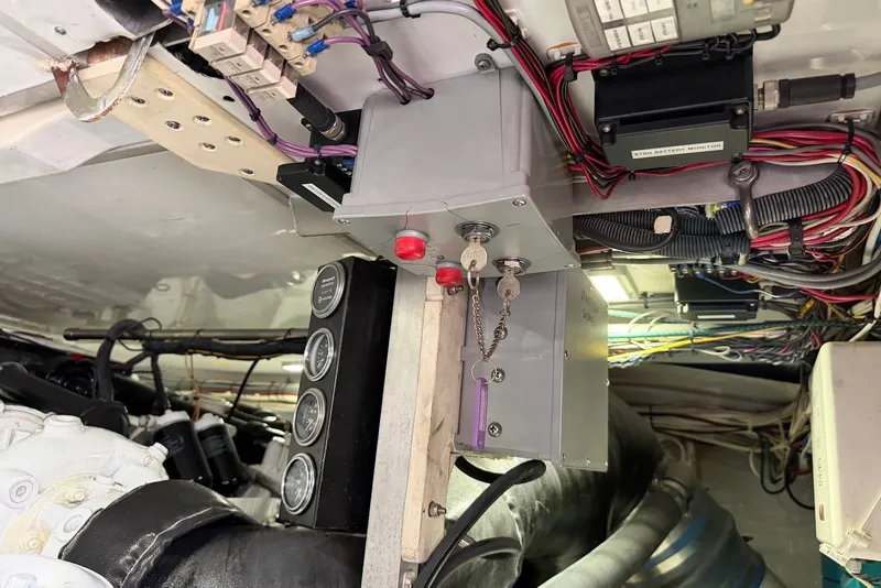 Slide: The Image of Engine room wiring and controls of a 1996 Post 50 Convertible boat. - 41