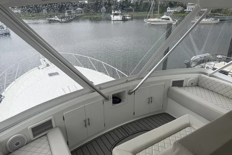 Slide: The Image of Interior view of a 1996 Post 50 Convertible yacht with rain-soaked windows. - 10