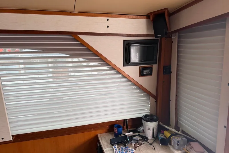 Slide: The Image of Interior of a 1996 Post 50 Convertible boat with blinds and electronic equipment. - 17