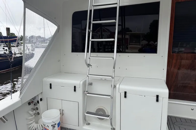 Slide: The Image of 1996 Post 50 Convertible yacht deck with ladder and storage compartments. - 8