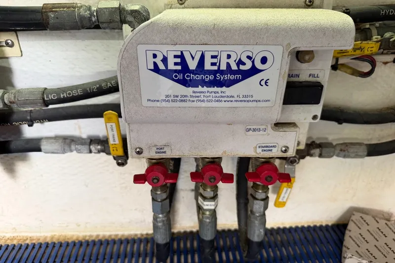 Slide: The Image of Reverso oil change system with valves and hoses in a 1996 Post 50 Convertible. - 43