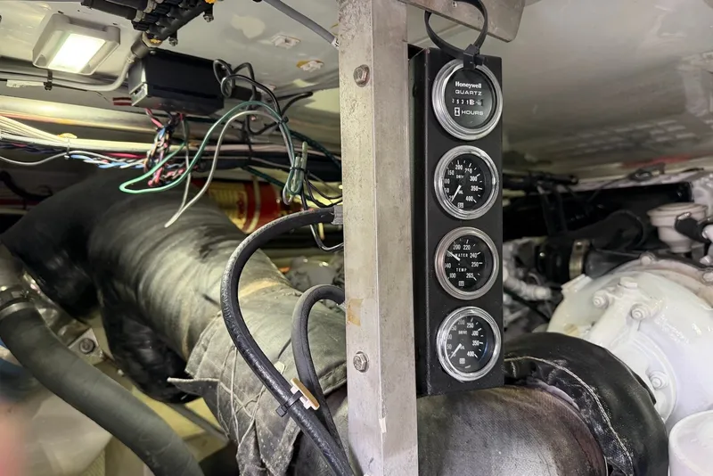Slide: The Image of Engine room of a 1996 Post 50 Convertible with gauges and wiring. - 40