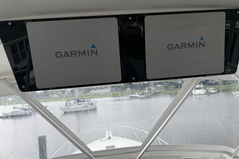 Slide: The Image of Interior view of a 1996 Post 50 Convertible boat with Garmin navigation displays. - 12