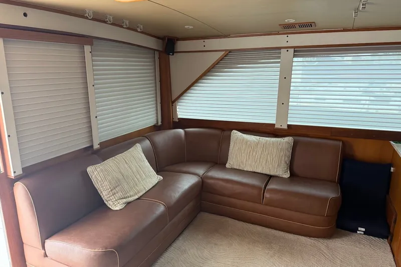 Slide: The Image of Luxurious interior of a 1996 Post 50 Convertible yacht with leather seating and window blinds. - 18