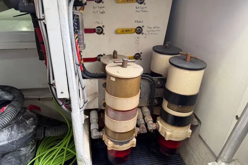 Slide: The Image of Engine room of a 1996 Post 50 Convertible with fuel filters and wiring. - 46