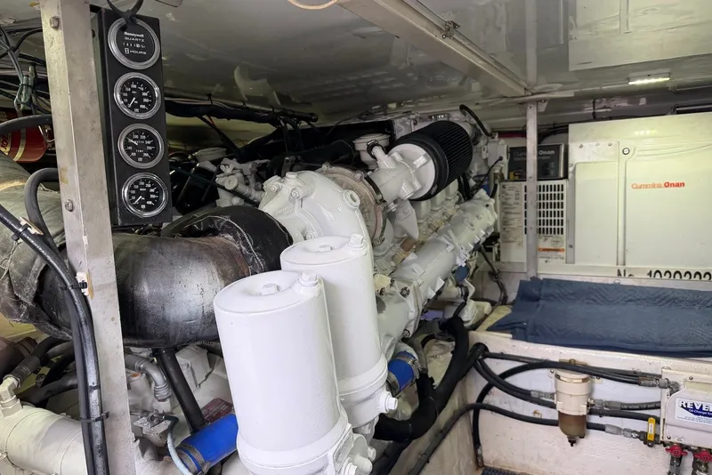 Slide: The Image of Engine room of a 1996 Post 50 Convertible yacht with Cummins Onan generator. - 38