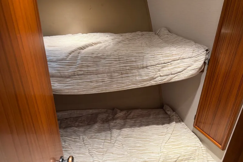Slide: The Image of Bunk beds in a 1996 Post 50 Convertible yacht cabin. - 33