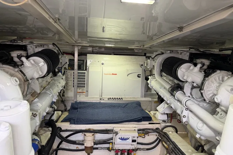 Slide: The Image of Engine room of a 1996 Post 50 Convertible yacht with Cummins Onan generator. - 39