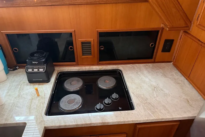 Slide: The Image of Kitchen area in a 1996 Post 50 Convertible yacht with stove and blender. - 21