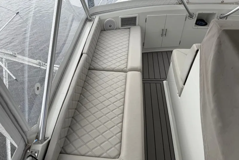 Slide: The Image of Luxurious interior of a 1996 Post 50 Convertible yacht with quilted seating. - 9