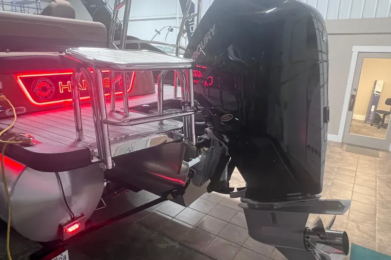 Slide: The Image of 2027 Harris Grand Mariner 250 SL boat with Mercury outboard motor and illuminated deck. - 65