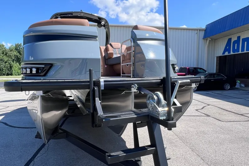 Slide: The Image of 2027 Harris Grand Mariner 250 SL pontoon boat on trailer, parked outdoors. - 52