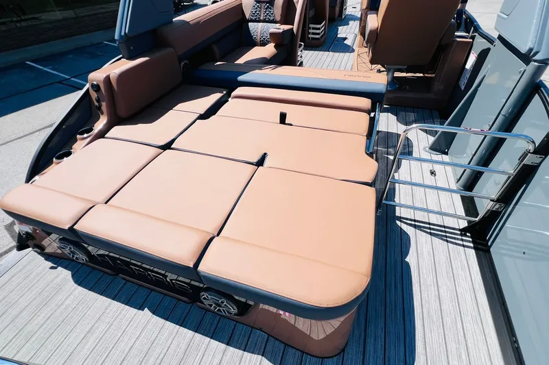 Slide: The Image of Luxurious seating on 2027 Harris Grand Mariner 250 SL pontoon boat, featuring tan upholstery. - 31