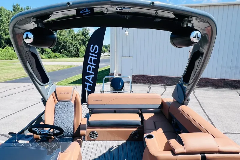 Slide: The Image of 2027 Harris Grand Mariner 250 SL pontoon boat with luxurious seating and sleek design. - 6