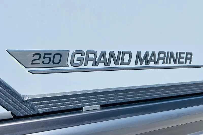 Slide: The Image of 2027 Harris Grand Mariner 250 SL logo on sleek boat exterior. - 43