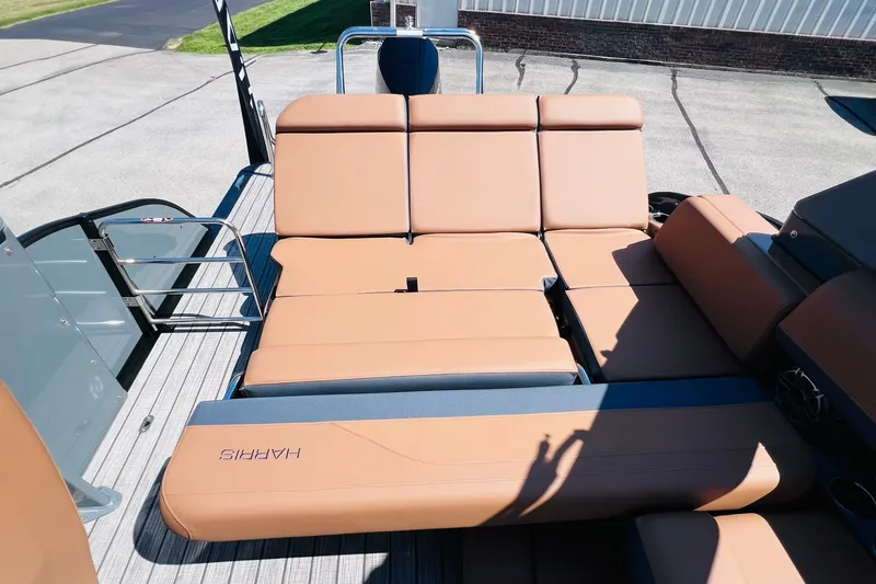 Slide: The Image of Luxurious seating on 2027 Harris Grand Mariner 250 SL pontoon boat, featuring tan upholstery. - 29
