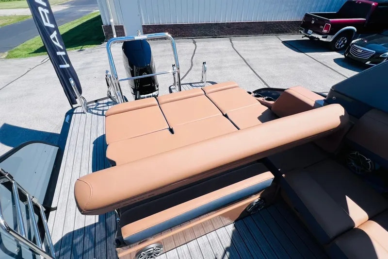 Slide: The Image of 2027 Harris Grand Mariner 250 SL boat with tan seating and sleek design. - 28