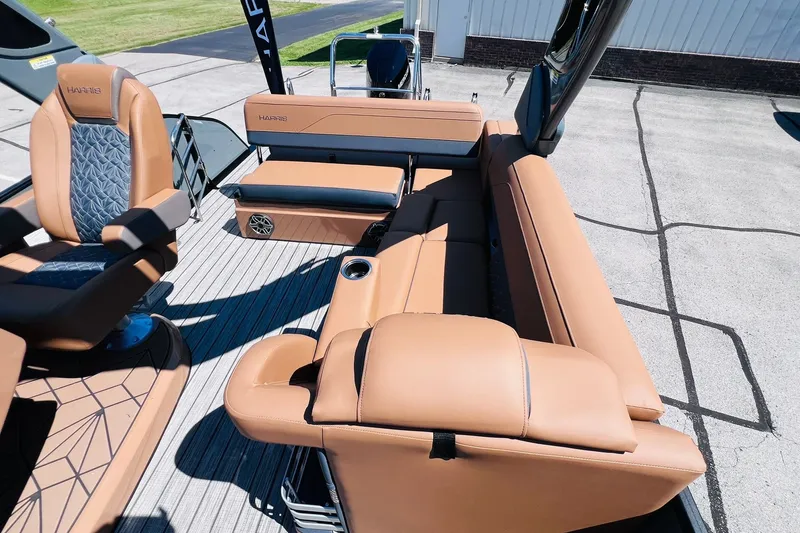 Slide: The Image of Luxurious seating on 2027 Harris Grand Mariner 250 SL pontoon boat, featuring tan upholstery. - 7