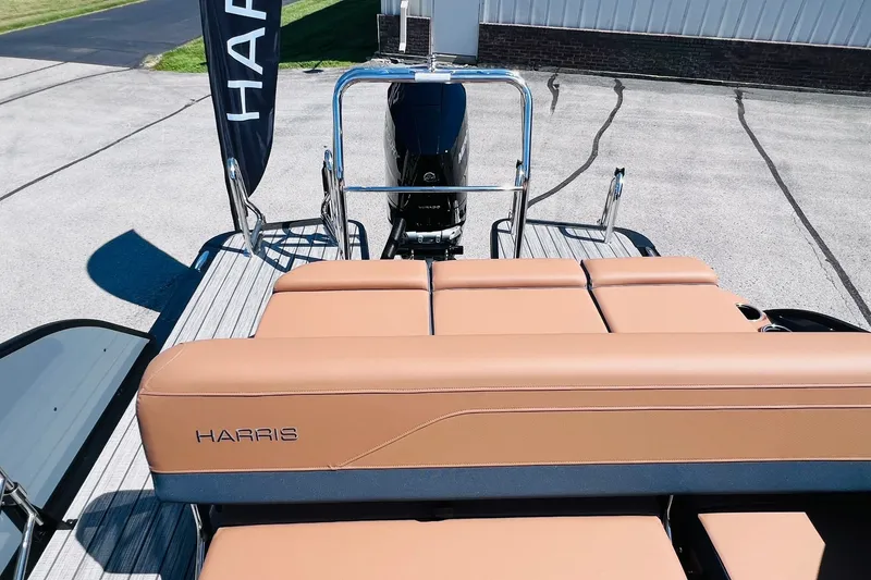 Slide: The Image of 2027 Harris Grand Mariner 250 SL boat with tan seating and sleek design. - 27