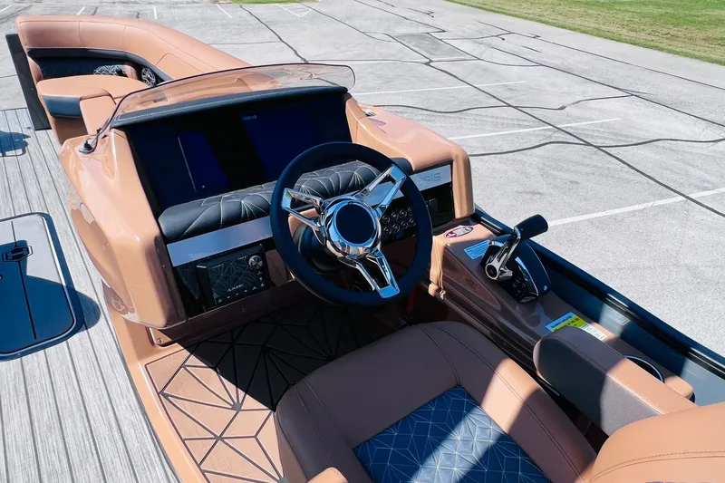 Slide: The Image of 2027 Harris Grand Mariner 250 SL boat cockpit with modern steering and controls. - 11