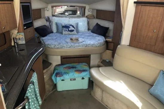 Slide: The Image of Interior of 2006 Sea Ray Sundancer 320 with cozy bed and seating area. - 12